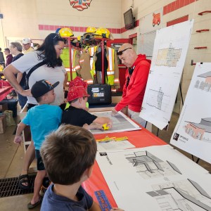 Abbey discussing proposed new fire house for city of Waverly. 